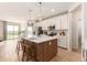 Modern kitchen with island and stainless steel appliances at 18252 W Cielo Grande Ave, Surprise, AZ 85387