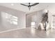 Living room with tile floors, staircase, and ceiling fan at 8605 E Posada Ave, Mesa, AZ 85212