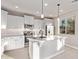 Modern kitchen with stainless steel appliances and white cabinetry at 8605 E Posada Ave, Mesa, AZ 85212