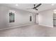 Well-lit bedroom featuring carpet and ceiling fan at 8605 E Posada Ave, Mesa, AZ 85212