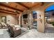 Outdoor patio with fireplace, TV, and comfortable seating at 19481 N 98Th Pl, Scottsdale, AZ 85255