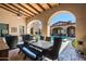 Covered patio with dining area, offering pool and mountain views at 19481 N 98Th Pl, Scottsdale, AZ 85255