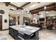 Island kitchen features granite countertops and open views to Gathering room at 19481 N 98Th Pl, Scottsdale, AZ 85255