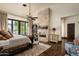 Serene bedroom with a fireplace and plenty of natural light at 19481 N 98Th Pl, Scottsdale, AZ 85255