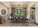 Elegant dining room features a large table and beautiful chandelier at 19481 N 98Th Pl, Scottsdale, AZ 85255