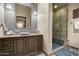 Contemporary bathroom with a floating sink and a glass-enclosed shower at 19481 N 98Th Pl, Scottsdale, AZ 85255