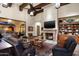 Spacious Gathering room features a fireplace, high ceilings, and lots of natural light at 19481 N 98Th Pl, Scottsdale, AZ 85255
