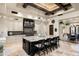 Open kitchen boasts a large island, custom cabinetry, and granite countertops at 19481 N 98Th Pl, Scottsdale, AZ 85255
