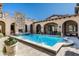 Inviting rectangular pool with fountain and stone accents at 19481 N 98Th Pl, Scottsdale, AZ 85255