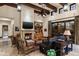 Gathering room with fireplace, built-in shelving, and comfortable seating at 19481 N 98Th Pl, Scottsdale, AZ 85255