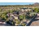 Aerial view showcasing a large home with a spacious backyard and tennis courts nearby at 19481 N 98Th Pl, Scottsdale, AZ 85255
