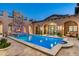 Luxury backyard oasis with a sparkling pool, spa, and fireplace at 19481 N 98Th Pl, Scottsdale, AZ 85255