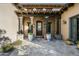 Elegant front entry with stone flooring and wood beams at 19481 N 98Th Pl, Scottsdale, AZ 85255