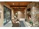Relaxing covered patio with a fireplace and comfortable seating at 19481 N 98Th Pl, Scottsdale, AZ 85255