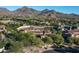 Aerial view of luxury home and mountain range at 19481 N 98Th Pl, Scottsdale, AZ 85255