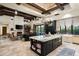 Open floor plan with kitchen island, Gathering room with fireplace, and high ceilings at 19481 N 98Th Pl, Scottsdale, AZ 85255