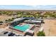 Aerial view of community pool, parking and residential area at 5234 E Umber Rd, San Tan Valley, AZ 85143