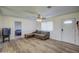 Living room features wood floors and a view to bedroom at 1601 E Loveland Ln, San Tan Valley, AZ 85140