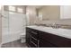 Bathroom with double vanity, soaking tub, and walk-in shower at 21950 N 100Th Ave, Peoria, AZ 85383