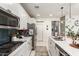 Clean kitchen featuring white cabinets, stainless steel appliances, and a breakfast bar at 2510 E Fawn Dr, Phoenix, AZ 85042