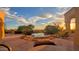 Tranquil backyard oasis with a pool, lounge chairs, and breathtaking sunset views at 4836 E White Gates Dr, Phoenix, AZ 85018