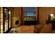 Spacious bedroom with fireplace, large window, city view at 4836 E White Gates Dr, Phoenix, AZ 85018