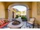 Peaceful patio with fire pit and seating area, offering scenic views at 4836 E White Gates Dr, Phoenix, AZ 85018