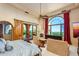 Large main bedroom with fireplace and stunning views at 4836 E White Gates Dr, Phoenix, AZ 85018