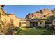 Landscaped backyard with putting green and mountain backdrop at 4836 E White Gates Dr, Phoenix, AZ 85018