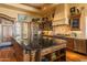 Island kitchen with granite countertops and stainless steel appliances at 4836 E White Gates Dr, Phoenix, AZ 85018