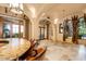 Spacious game room with granite bar, pool table, and large windows at 4836 E White Gates Dr, Phoenix, AZ 85018