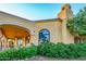 Elegant home exterior with arched entryways and lush landscaping at 4836 E White Gates Dr, Phoenix, AZ 85018