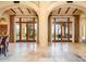 Elegant living area featuring high ceilings and tile floors at 4836 E White Gates Dr, Phoenix, AZ 85018