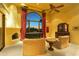 Bedroom with fireplace and large window with a view at 4836 E White Gates Dr, Phoenix, AZ 85018