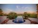Luxury pool and spa with mountain views at sunset at 4836 E White Gates Dr, Phoenix, AZ 85018