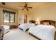 Bright bedroom with two twin beds and large window at 4836 E White Gates Dr, Phoenix, AZ 85018