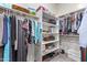 Large walk-in closet with ample shelving and hanging space at 23680 N 168Th Ln, Surprise, AZ 85387