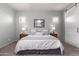Serene bedroom with king-size bed and plenty of natural light at 23680 N 168Th Ln, Surprise, AZ 85387
