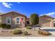Single-story home with landscaping and a two-car garage at 23680 N 168Th Ln, Surprise, AZ 85387