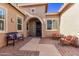Inviting courtyard entry with brick pavers, seating, and decorative accents at 23680 N 168Th Ln, Surprise, AZ 85387