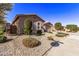 Single story home with a two car garage and desert landscaping at 23680 N 168Th Ln, Surprise, AZ 85387