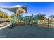 Community playground with play structures and shade covering at 23680 N 168Th Ln, Surprise, AZ 85387