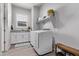 Laundry room with washer, dryer and storage at 23680 N 168Th Ln, Surprise, AZ 85387