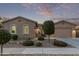 Single-story home with landscaping and a two-car garage at 23680 N 168Th Ln, Surprise, AZ 85387