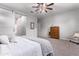 Spacious bedroom with carpeted floors and a barn door at 23680 N 168Th Ln, Surprise, AZ 85387