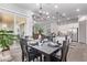 Bright dining room with a view of the back patio and kitchen at 23680 N 168Th Ln, Surprise, AZ 85387