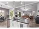 Modern kitchen with a large island, stainless steel appliances, and white cabinets at 23680 N 168Th Ln, Surprise, AZ 85387