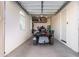 Garage with a three-wheeled motorcycle and storage at 23680 N 168Th Ln, Surprise, AZ 85387