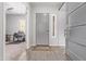 Bright and airy entryway with wood-look tile floors and a modern barn door at 23680 N 168Th Ln, Surprise, AZ 85387