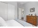 Bedroom with a dresser, closet, and view of another room at 23680 N 168Th Ln, Surprise, AZ 85387